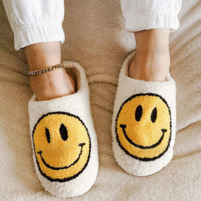 happy face slippers in white and yellow
