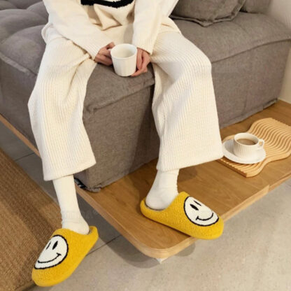 happy face slippers on model